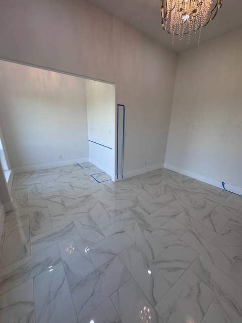 Primary-suite room before the custom dressing-room cabinetry was built.