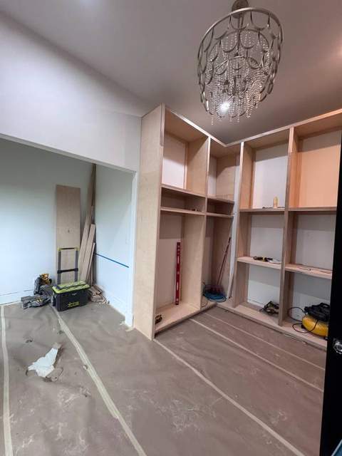 Custom dressing-room cabinetry during construction.