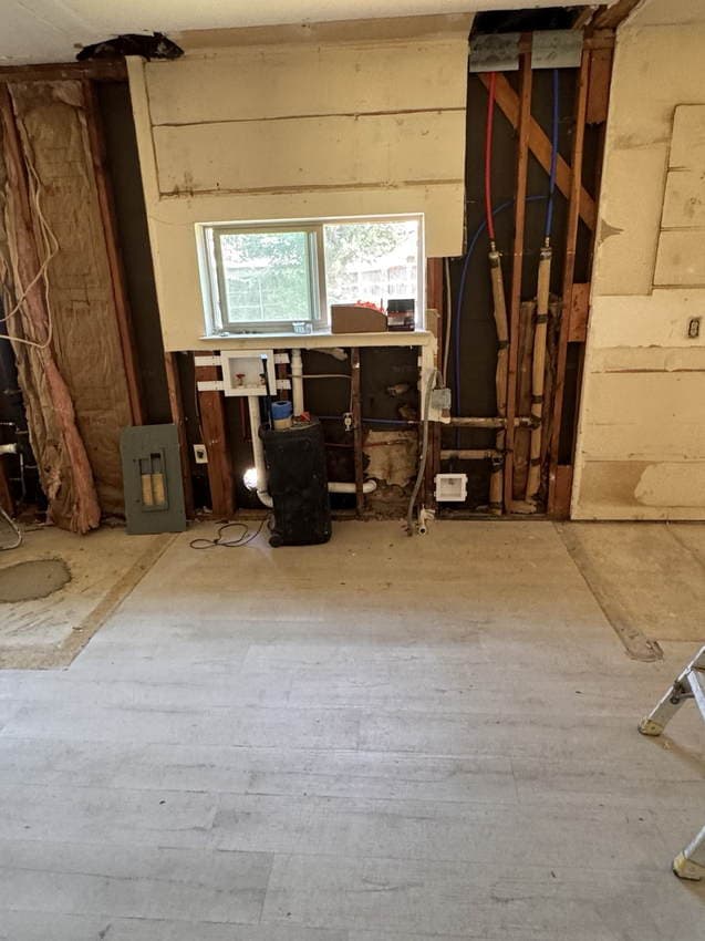 Open-wall construction progress during the whole-home renovation and kitchen reconstruction.